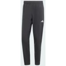 Брюки Adidas TR-ES WOVEN PT IT5457 р. M черный